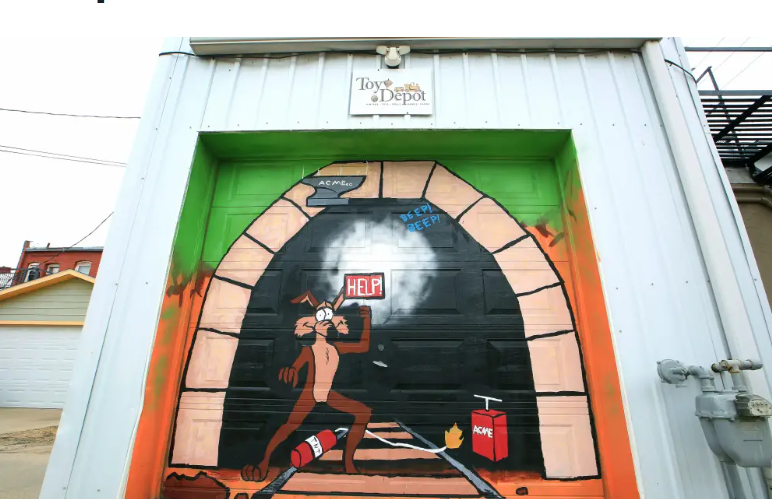 Acme Cartoon with Coyote drawing tunnel on garage